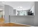 Open kitchen with white cabinetry, granite countertops and stainless steel appliances at 103 Trent Woods Way, Cary, NC 27519
