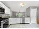 Bright kitchen area leads to dining area with views to the deck and backyard at 103 Trent Woods Way, Cary, NC 27519
