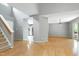 Open-concept layout with hardwood floors connecting the living and kitchen areas at 103 Trent Woods Way, Cary, NC 27519