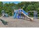 Great community playground with slides, climbing structures, and swings for the neighborhood children at 103 Trent Woods Way, Cary, NC 27519