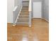 Interior view of carpeted stairs with hardwood floors and light gray walls at 103 Trent Woods Way, Cary, NC 27519