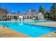 Enjoy relaxing by the community swimming pool and pool house on a hot summer day at 103 Trent Woods Way, Cary, NC 27519