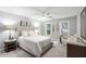 Bright bedroom with neutral tones features natural light, carpeted floors, and ample closet space for comfortable living at 105 Bergeron Way, Cary, NC 27519