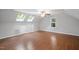 Bedroom featuring wood floors, skylights, and a ceiling fan at 105 Bergeron Way, Cary, NC 27519