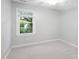 Bedroom with a neutral palette featuring a large window providing lots of natural light at 105 Bergeron Way, Cary, NC 27519