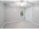 Comfortable bedroom featuring natural light, neutral walls, and a ceiling fan at 105 Bergeron Way, Cary, NC 27519