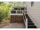 Exterior view of the back deck of the house featuring outdoor grill, access to a screened porch and backyard at 105 Bergeron Way, Cary, NC 27519
