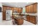 Spacious kitchen features stainless steel appliances, an island with seating, and ample cabinet space at 105 Bergeron Way, Cary, NC 27519