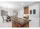 A well-designed kitchen seamlessly connecting to a dining area, offering a flexible living space with modern features at 105 Bergeron Way, Cary, NC 27519