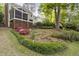 Beautiful landscaping and a screened porch highlight this home's exterior features at 105 Bergeron Way, Cary, NC 27519