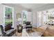 Sunlit office space with hardwood floors and gray accent chairs at 105 Bergeron Way, Cary, NC 27519