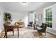 Bright office space featuring hardwood floors, shuttered windows, and neutral paint at 105 Bergeron Way, Cary, NC 27519