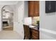 A charming office nook with wooden cabinets and a granite countertop complements the house's interior design at 105 Bergeron Way, Cary, NC 27519