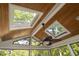 Screened in porch with wood ceiling and skylights, ceiling fan, and outdoor views at 105 Bergeron Way, Cary, NC 27519