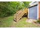 Backyard deck and stairs lead to a private yard at 107 E Hammond St, Durham, NC 27704
