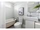 Traditional bathroom with vintage clawfoot tub, toilet, and basin style sink at 107 E Hammond St, Durham, NC 27704