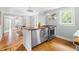 Spacious kitchen with butcher block island, stainless steel appliances, and dining area at 107 E Hammond St, Durham, NC 27704