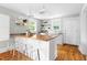 Bright kitchen featuring a wood countertop island, white cabinetry, and stainless steel appliances at 107 E Hammond St, Durham, NC 27704