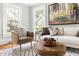 Bright living room showcasing neutral furniture, hardwood floors, natural light, and a stylish decor at 107 E Hammond St, Durham, NC 27704