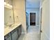 A bathroom with a vanity, frameless shower, and a walk-in closet at 1091 Fairhaven Dr # 47, Mebane, NC 27302