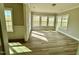 Bright sun room filled with natural light and hardwood floors at 1091 Fairhaven Dr # 47, Mebane, NC 27302