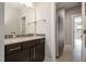 Beautiful bathroom with a granite vanity, stainless fixtures and door to the shower-tub combo at 1112 Valley Rose Way, Durham, NC 27712