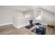 Versatile bonus room with ample space for gym or recreation, featuring updated floors and a window at 1112 Valley Rose Way, Durham, NC 27712