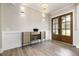 Elegant entryway features a modern cabinet, stylish light fixtures, and beautiful wood-look floors at 1112 Valley Rose Way, Durham, NC 27712