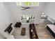 Open-concept living room boasts a fireplace, vaulted ceilings, deck access, and modern finishes, perfect for entertaining at 1112 Valley Rose Way, Durham, NC 27712