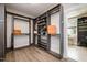 Spacious walk-in closet with custom shelving, hanging rods and plenty of storage for clothes, shoes, and accessories at 1112 Valley Rose Way, Durham, NC 27712