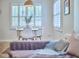 The dining area features natural light, a modern table, and charming window shutters at 115 Standish Dr, Chapel Hill, NC 27517