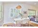 Elegant dining area with a cozy table, ample natural light, and relaxing atmosphere at 115 Standish Dr, Chapel Hill, NC 27517
