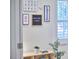 Welcoming entryway with unique artwork and a charming 'Welcome Home' sign, creating a warm and inviting first impression at 115 Standish Dr, Chapel Hill, NC 27517