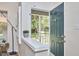 Welcoming entryway featuring natural light, a stylish lamp, and a charming view of the front porch at 115 Standish Dr, Chapel Hill, NC 27517