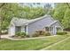 Well maintained home featuring manicured bushes, vinyl siding, green grass and a manicured flower bed at 115 Standish Dr, Chapel Hill, NC 27517