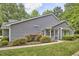 Beautiful home with vinyl siding, lush greenery, well-manicured bushes and flower beds at 115 Standish Dr, Chapel Hill, NC 27517
