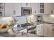 Kitchen showcasing stainless steel appliances, granite countertops, and white cabinets at 115 Standish Dr, Chapel Hill, NC 27517