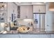 Modern kitchen boasts stainless steel appliances, granite countertops, and custom cabinetry at 115 Standish Dr, Chapel Hill, NC 27517