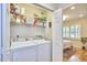 Convenient laundry room with washer, dryer, and shelving, making laundry chores more efficient and organized at 115 Standish Dr, Chapel Hill, NC 27517