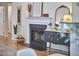 Elegant living room with fireplace, decorative mirror, and stylish furniture at 115 Standish Dr, Chapel Hill, NC 27517
