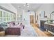 Bright living room with a fireplace, comfortable seating, and an open floor plan at 115 Standish Dr, Chapel Hill, NC 27517