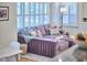 Cozy living room with plush purple sectional sofa and bright window views at 115 Standish Dr, Chapel Hill, NC 27517