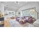 Spacious living room featuring plush seating, a fireplace, and plenty of natural light at 115 Standish Dr, Chapel Hill, NC 27517