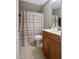 This bathroom features a shower with a curtain, a sink, and a toilet at 120 Wood Lake Dr, Fuquay Varina, NC 27526