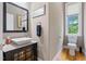 Stylish powder room with a modern vessel sink, granite countertop, and a window at 120 Wood Lake Dr, Fuquay Varina, NC 27526