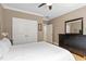 A bright bedroom with hardwood floors, a ceiling fan, and fresh paint at 120 Wood Lake Dr, Fuquay Varina, NC 27526