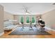 Large bonus room featuring lots of windows, a ceiling fan, and hardwood floors at 120 Wood Lake Dr, Fuquay Varina, NC 27526