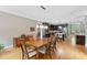 Dining area with hardwood floors, contemporary furniture, and an open view into the gourmet kitchen at 120 Wood Lake Dr, Fuquay Varina, NC 27526