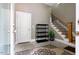 Foyer with stairs, rug, storage shelf, and exterior door at 120 Wood Lake Dr, Fuquay Varina, NC 27526