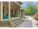 Inviting front porch with cozy seating and well-manicured landscaping creating a welcoming entrance at 120 Wood Lake Dr, Fuquay Varina, NC 27526